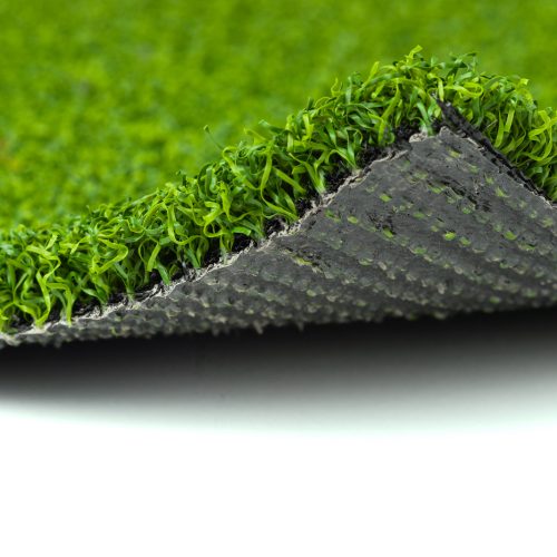 Flipped Up Section of Artificial Turf Grass On White Background.